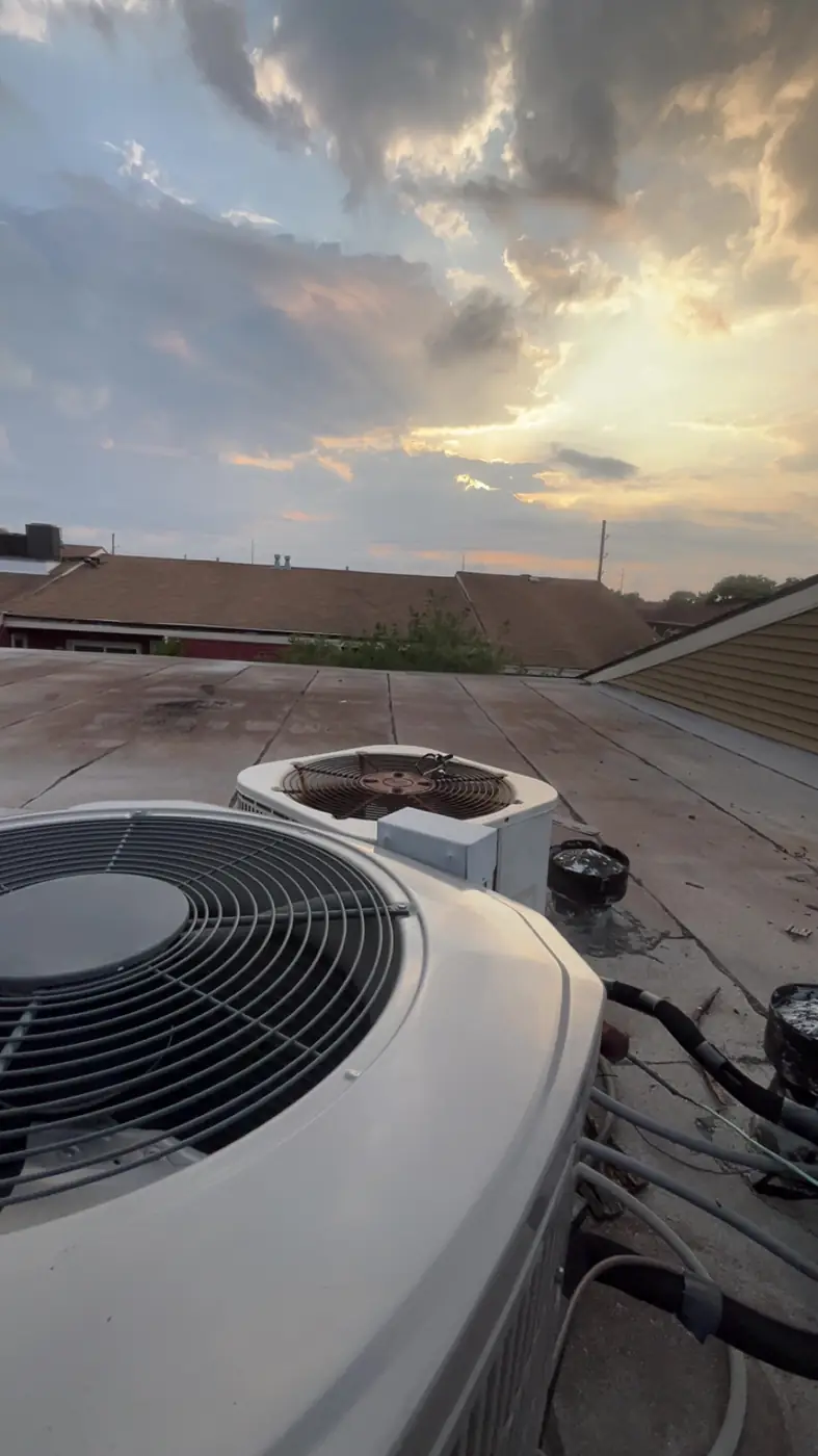 Commercial rooftop HVAC unit at sunset, Kenner