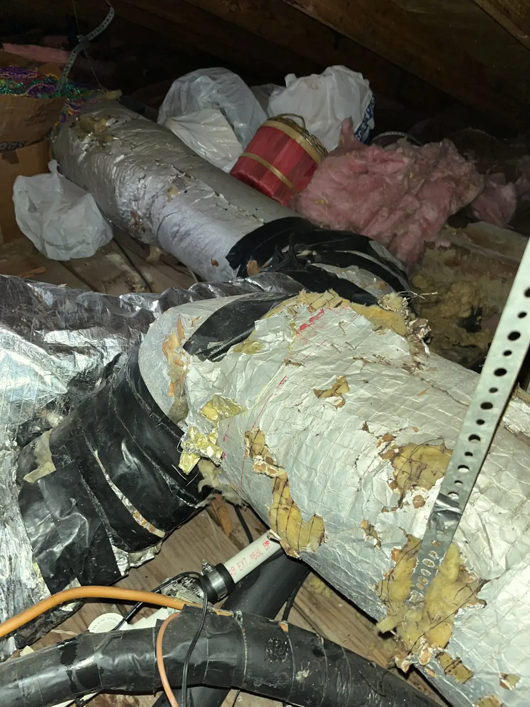 Flex duct with its outer jacket falling apart in an attic, Kenner